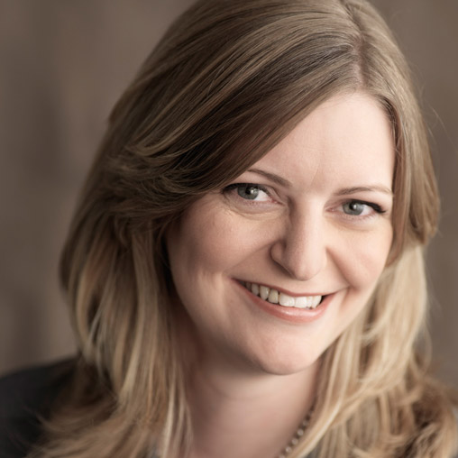 A close-up of a woman smiling.