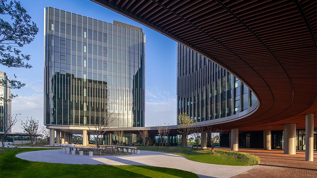 Colored pencil benches are pictured at a square amongst office buildings in  Guangzhou city, south China's Guangdong province, 23 June 2019. A square  amongst a cluster of high-rise office buildings in China's