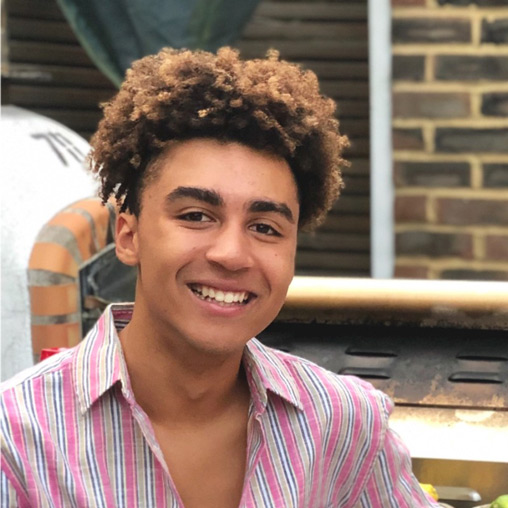 A person with curly hair.