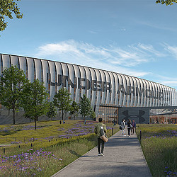 A building with a walkway and people walking around.