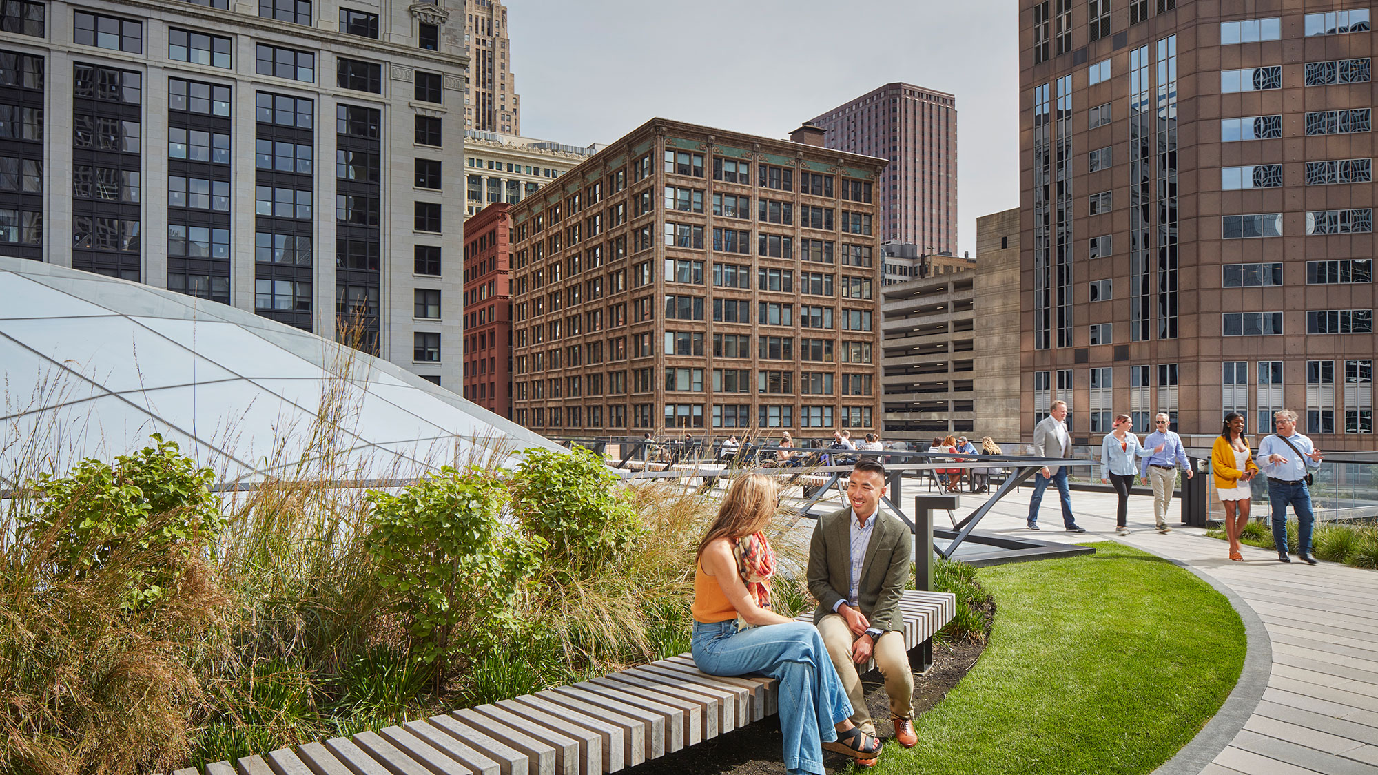 People gather in a rooftop garden at Willis Tower.