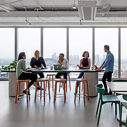 Employees sitting at Citrix Sydney office cafe bar table