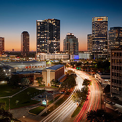 Aspire Post Oak building in Houston skyline at night