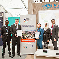 A group of people holding a certificate.