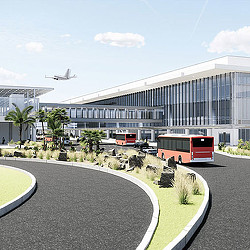 A large building with a plane flying by.