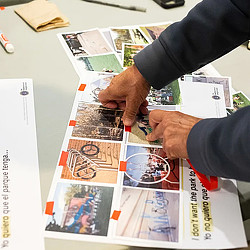 Close-up of community member's hands completing a worksheet. Credit: Side A Photography.
