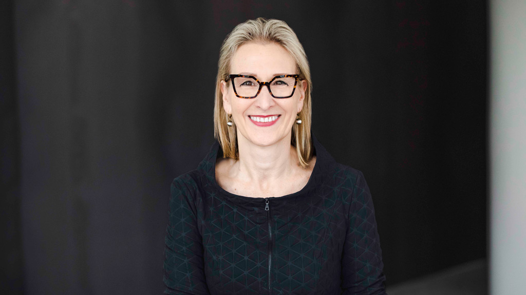 A woman wearing glasses.