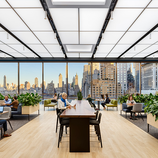 Confidential financial services firm open office with New York city views.