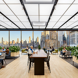 Confidential financial services firm open office with New York city views.