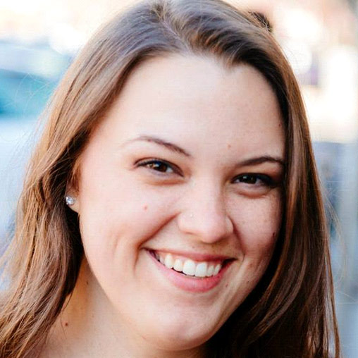 A close-up of a woman smiling.