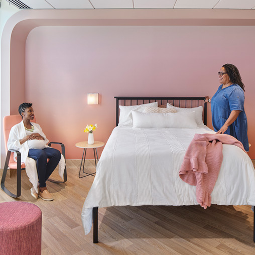 A person sitting on a bed.