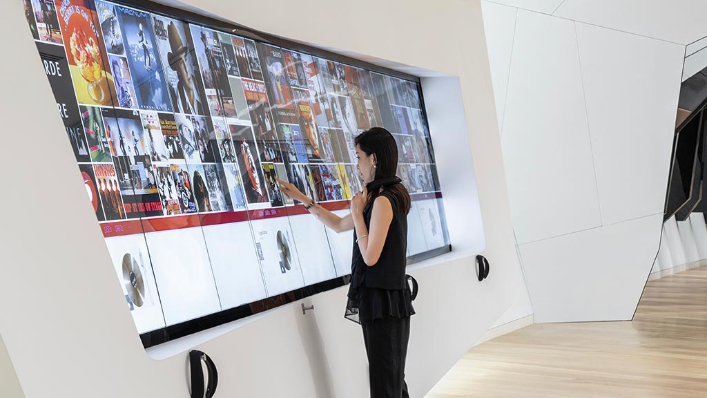 A person standing in front of a display.