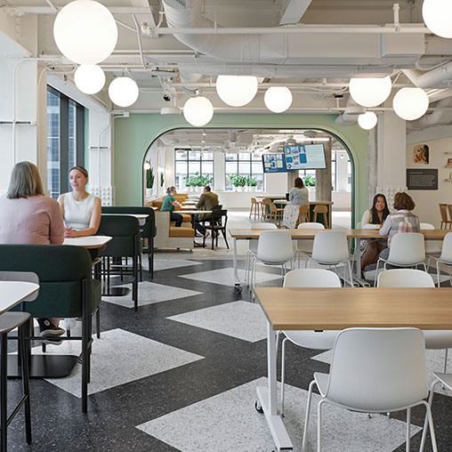 People sitting at tables in a room.