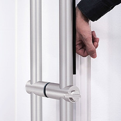 A hand opening a door.