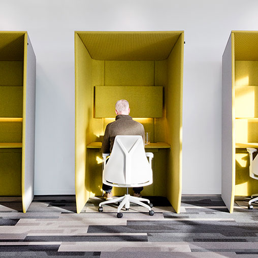 A person in a suit in a room.