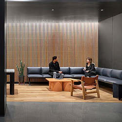 A man and woman sitting on a couch.