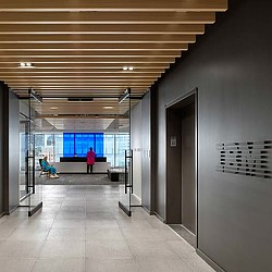 A person standing in a hallway.