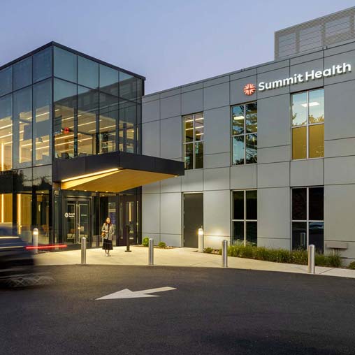 Exterior entrance to Summit Health Clifton at dusk