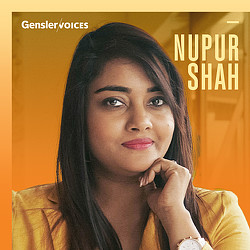 Nupur Shah with her hand on her chin.