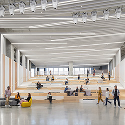 A group of people in a large room with a large group of people.