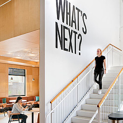 A person walking up a staircase.