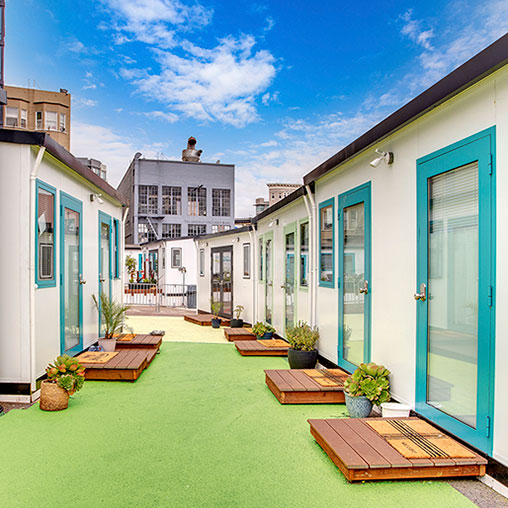 A row of buildings with a pool.