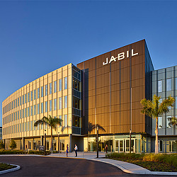 A large building with people walking around.