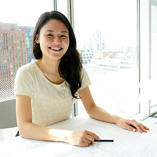 A woman sitting at a table.