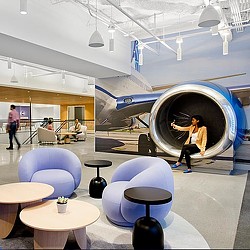 United Airlines HQ amenity space with airplane display