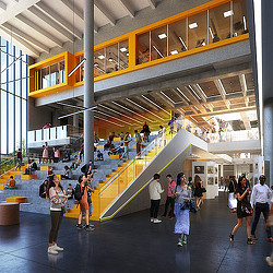 A group of people walking inside a building.