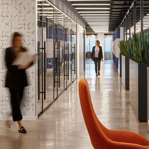 A person standing in a hallway.