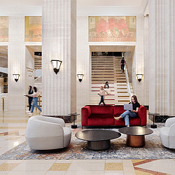 A historic interior with large pillars and lounge seating at THE MART in Chicago