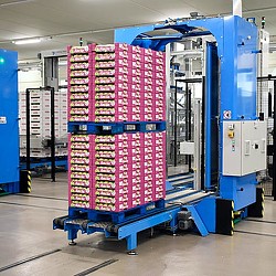 Fulfillment center with pink apple boxes. Credit: Arno Senoner via Unsplash