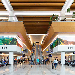 A group of people walking inside a building.
