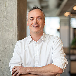 A man folding his arms.