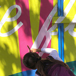A person painting a wall.