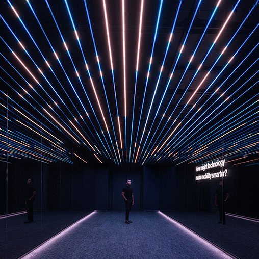 A person standing under a large ceiling.