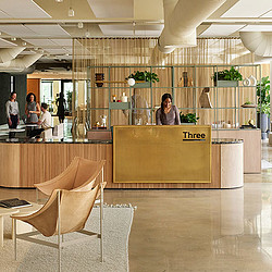 A person standing behind a counter.