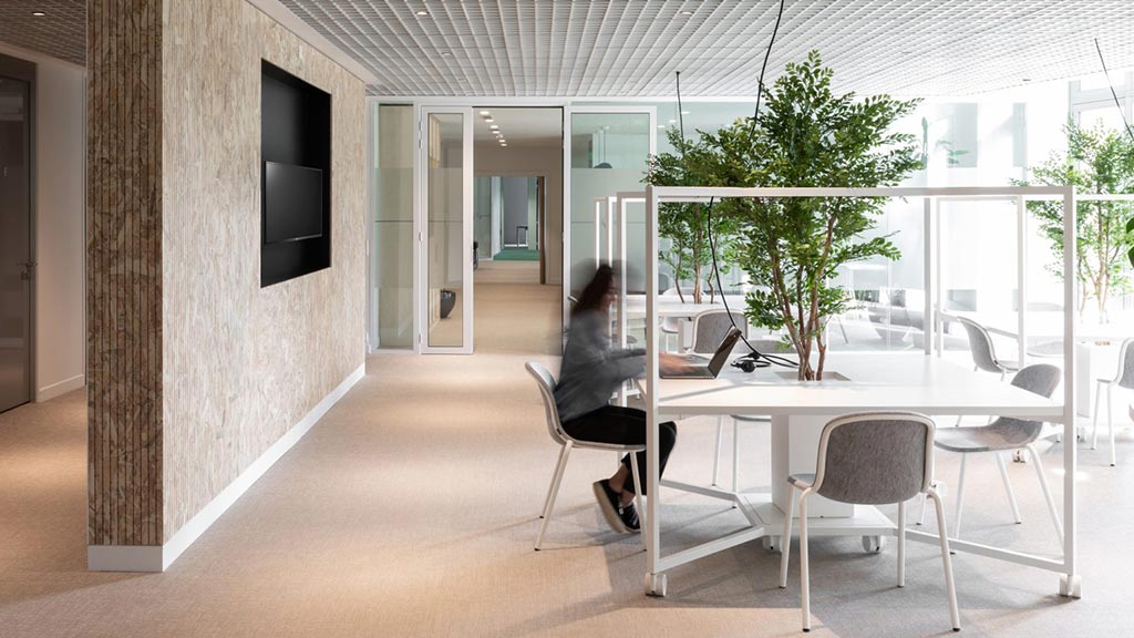A woman working on her laptop in Korn Ferry Paris office
