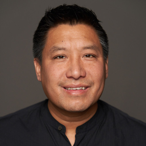 A man smiling for the camera.