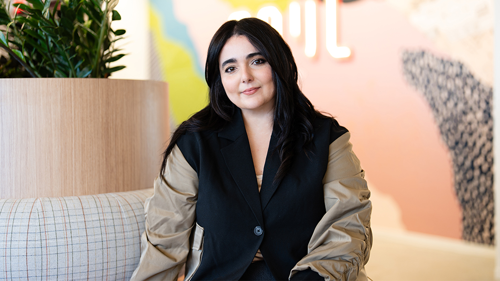 A woman sitting on a couch.