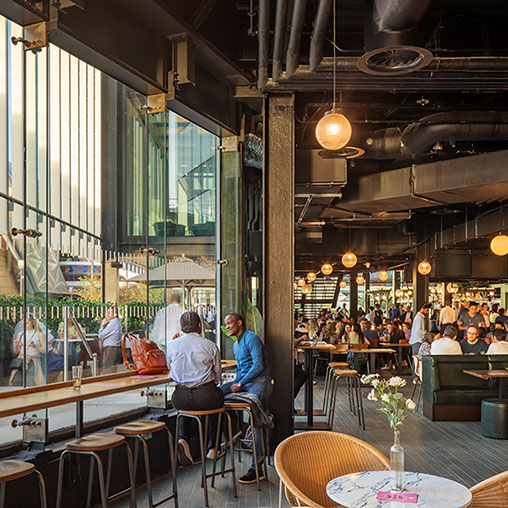People sitting at tables in a restaurant.