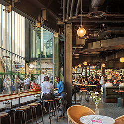 People sitting at tables in a restaurant.