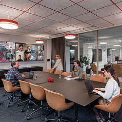 Hybrid meeting in Seattle office conference room