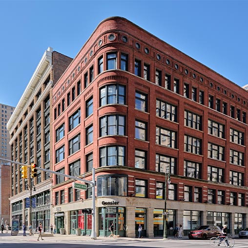 glass exterior image of the new gensler detroit office from street view.