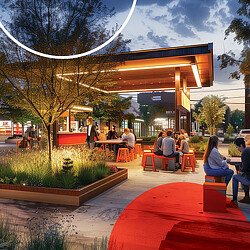 A group of people sitting outside a building.