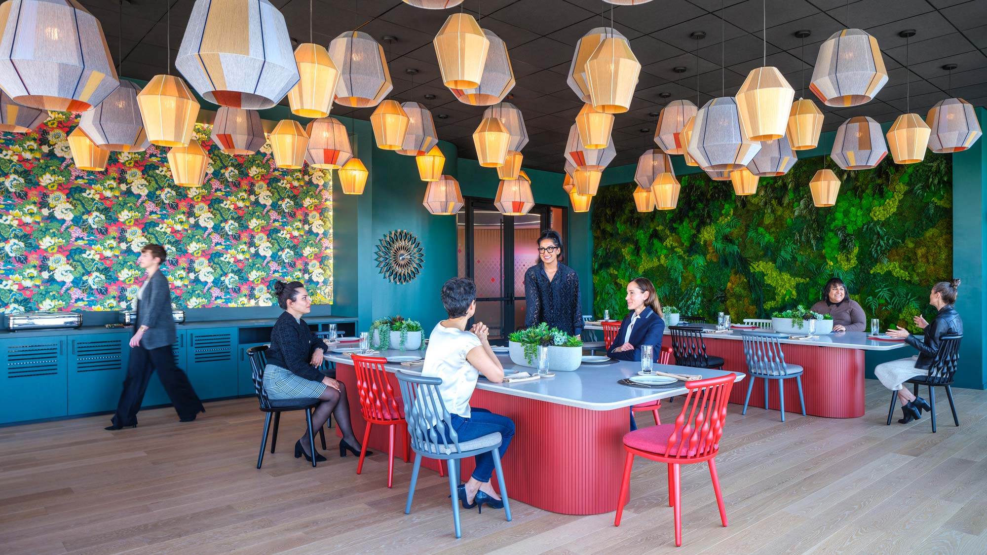 A group of people sitting at tables.