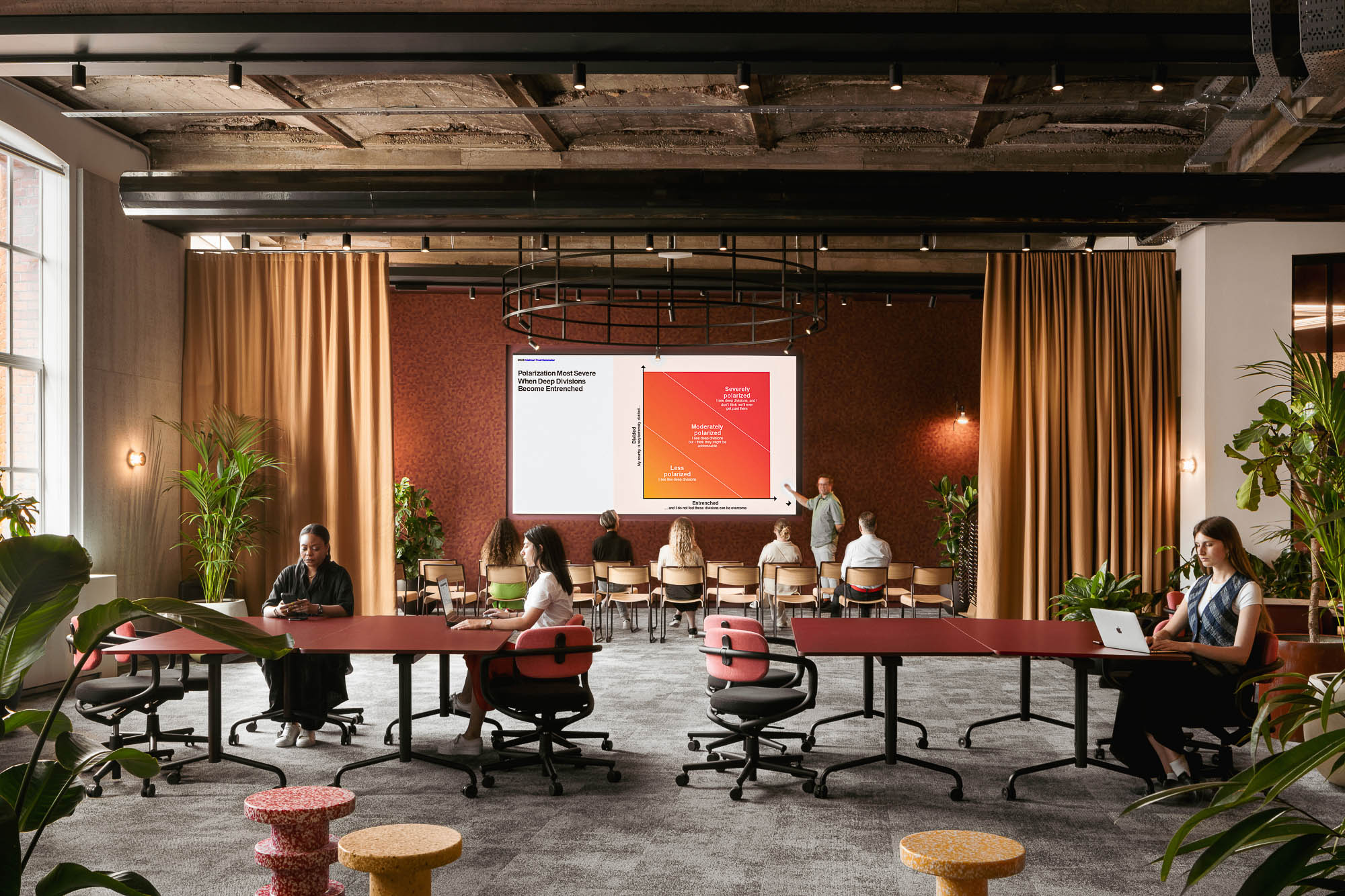 A group of people sitting at tables.