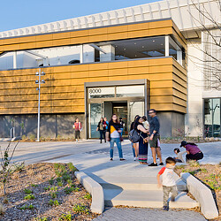 A group of people outside a building.