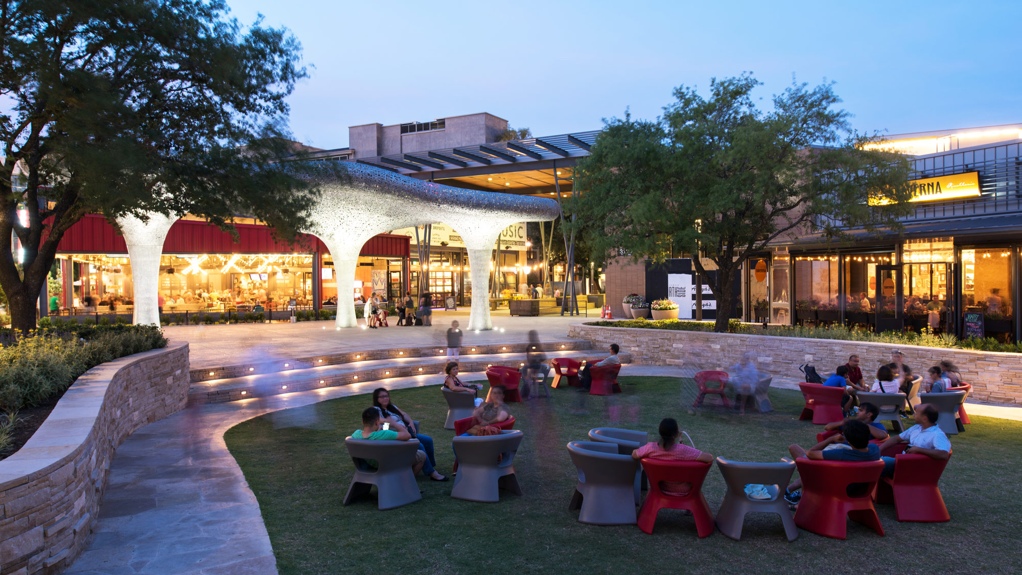 A group of people sitting outside.